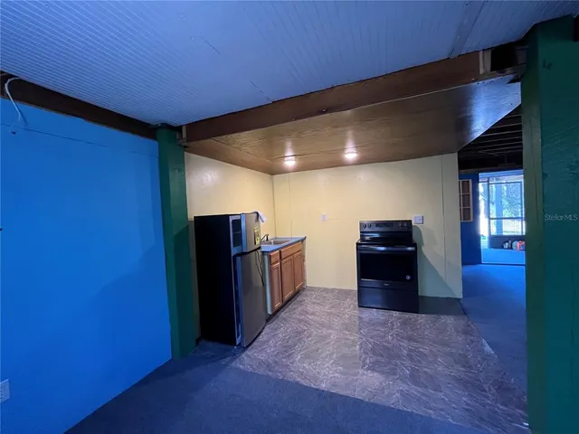a view of a storage & utility room with dryer and washer