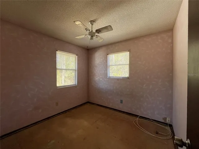a kitchen with granite countertop a sink and a stove