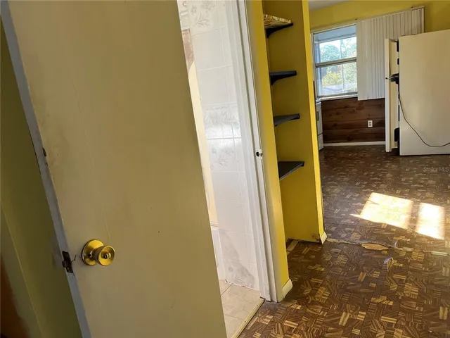 a view of empty room with windows