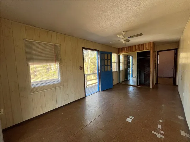 a view of livingroom with an empty space and a window