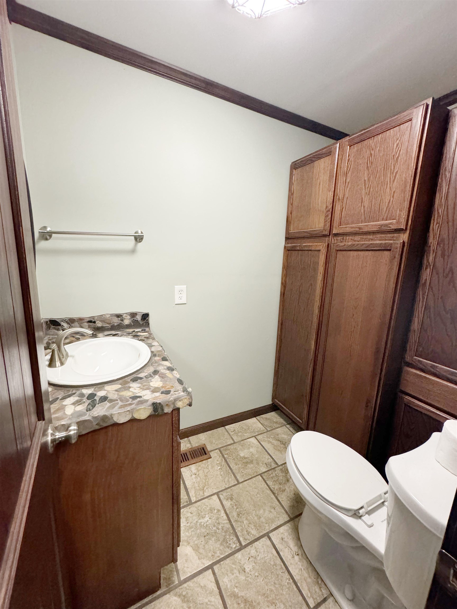951 Sloan Road Burlison, TN 38015 - Photo 14 of 29 a bathroom with a granite countertop sink toilet and shower