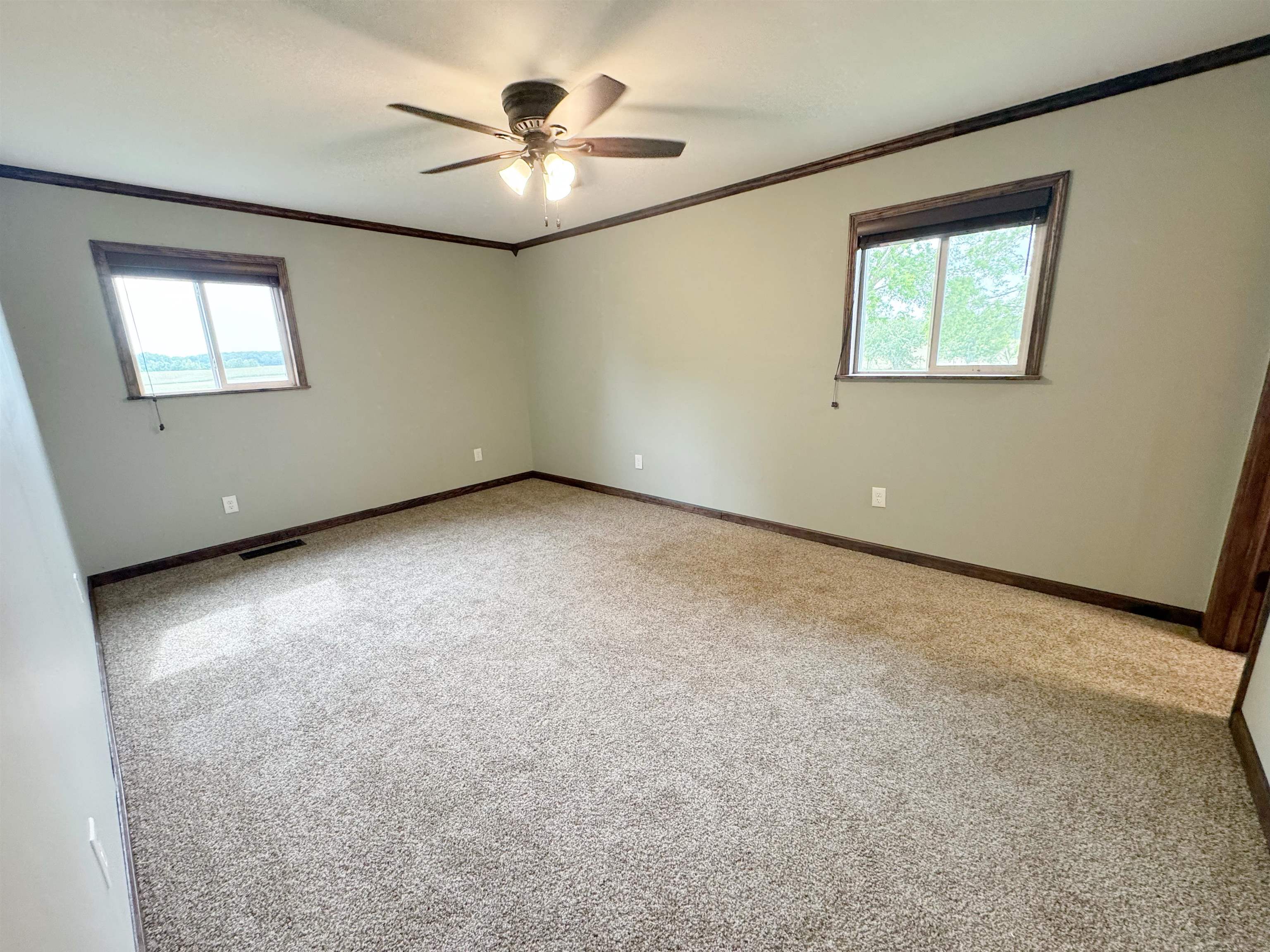 951 Sloan Road Burlison, TN 38015 - Photo 15 of 29 an empty room with windows and fan