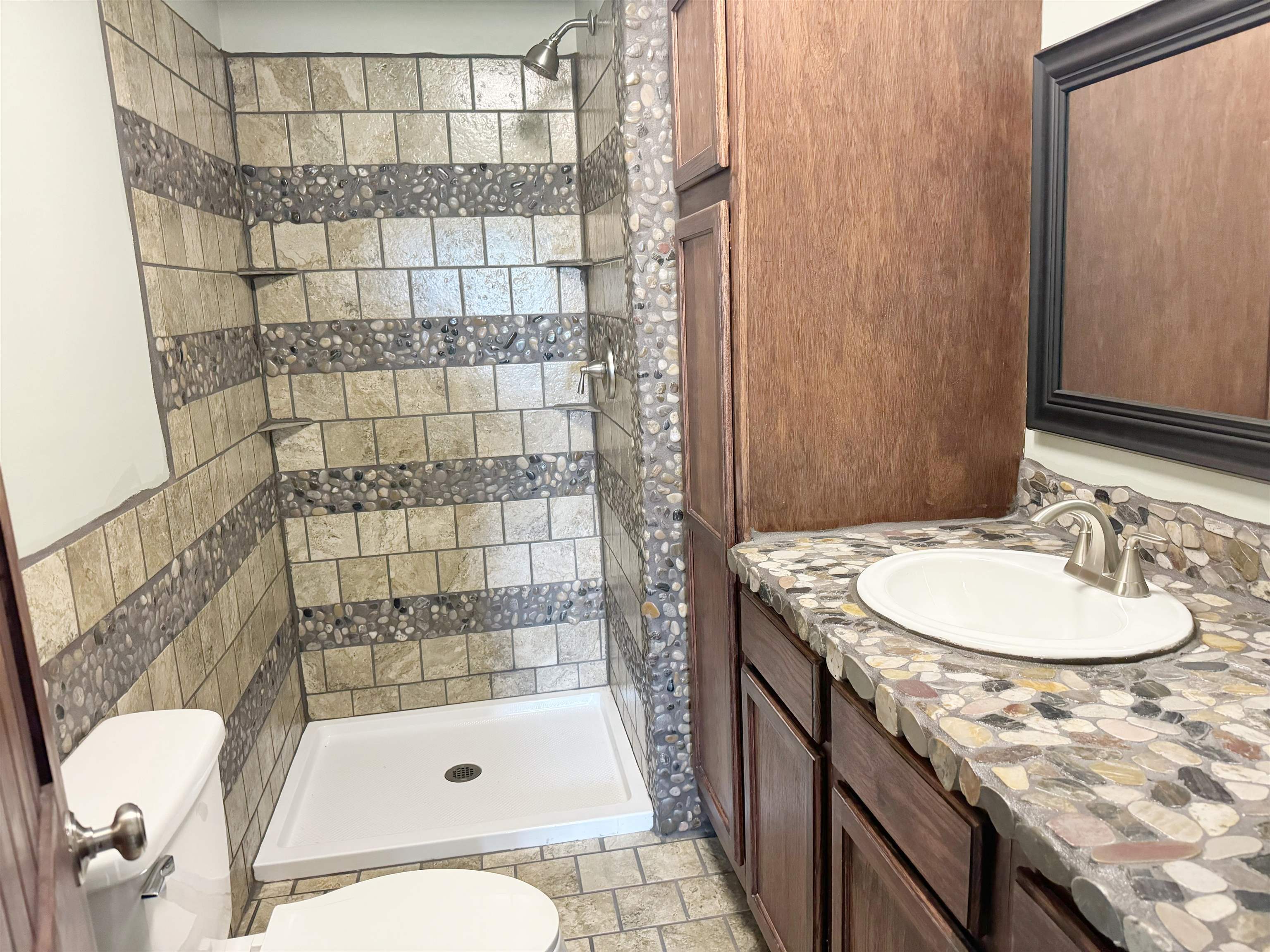 951 Sloan Road Burlison, TN 38015 - Photo 16 of 29 a bathroom with a sink toilet and shower