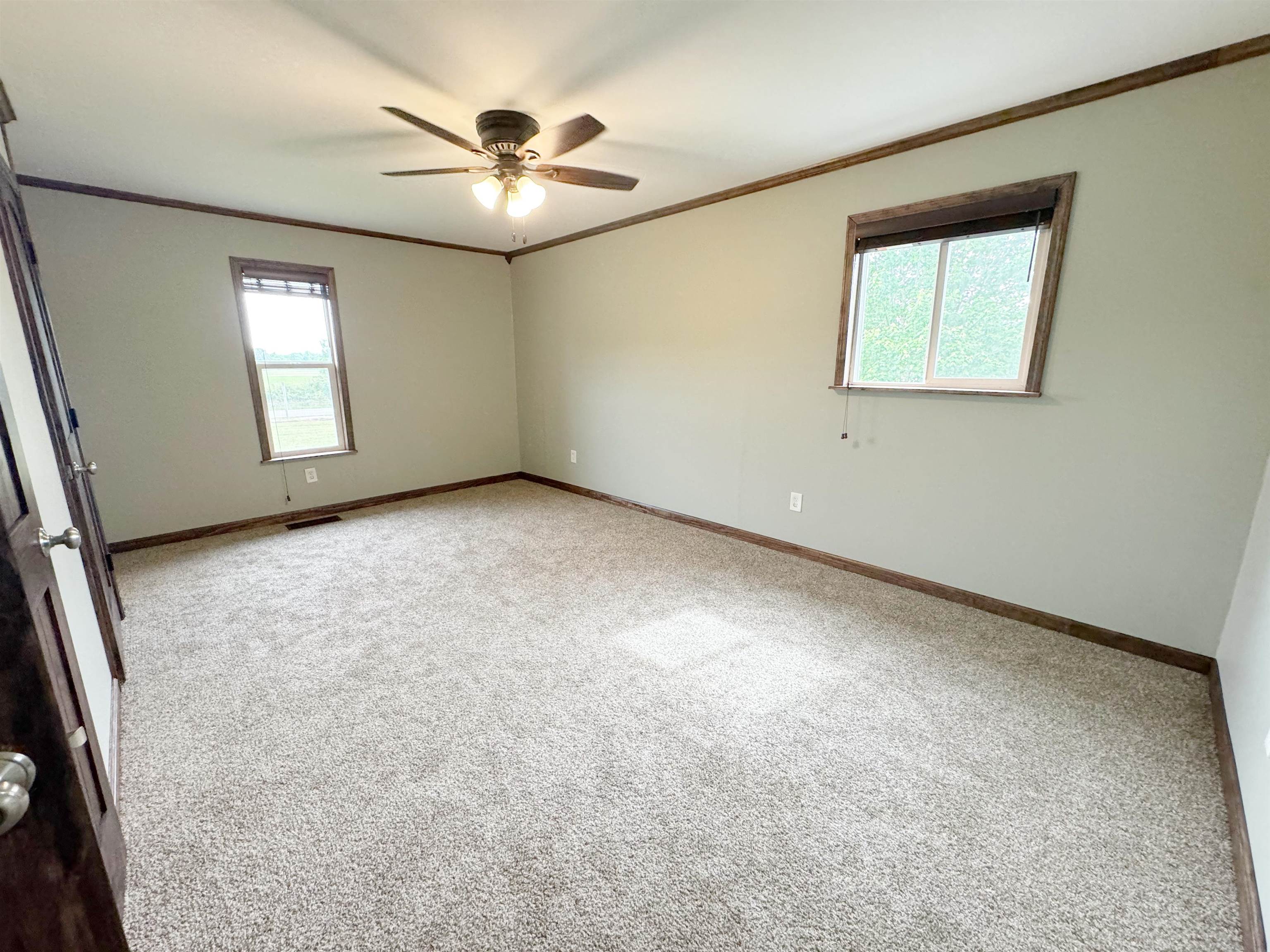 951 Sloan Road Burlison, TN 38015 - Photo 21 of 29 an empty room with windows and fan