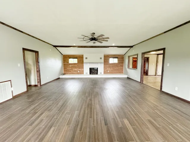 a view of a livingroom with wooden floor