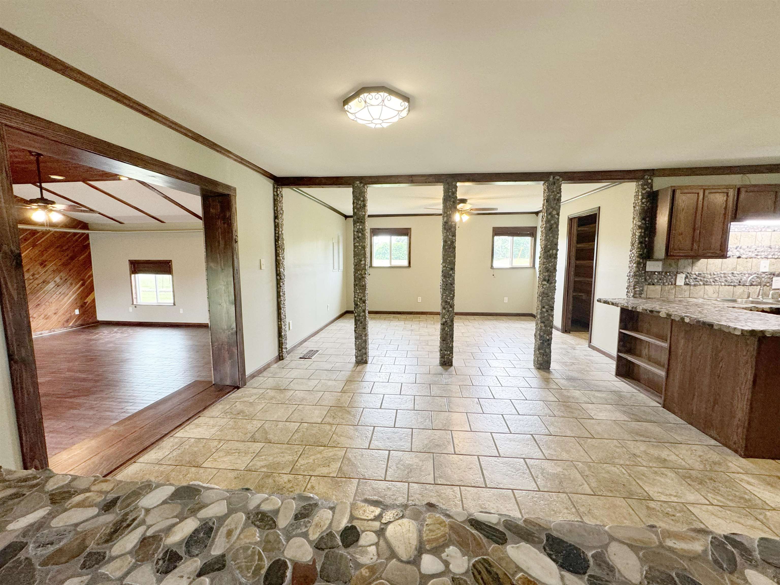 951 Sloan Road Burlison, TN 38015 - Photo 10 of 29 a hallway with a large window and wooden floor