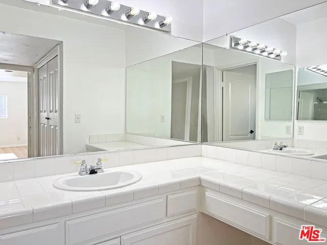 a view of a backyard with a table and chairs