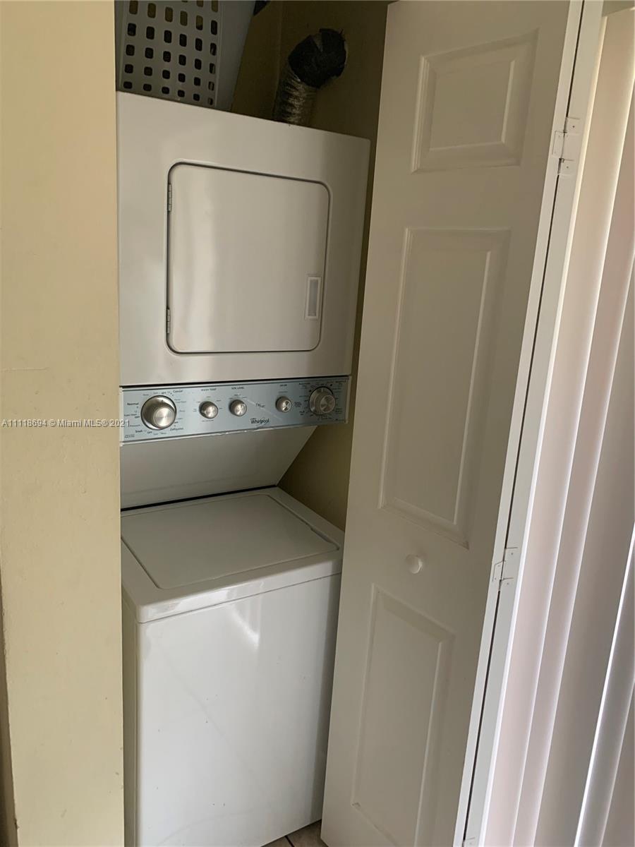 3770 North Jog Road, Unit 103 West Palm Beach, FL 33411 - Photo 6 of 15 a utility room with dryer and washer