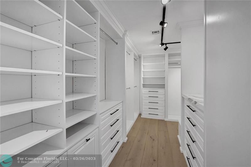 19 Seneca Road Sea Ranch Lakes, FL 33308 - Photo 28 of 48 a view of walk in closet with empty racks