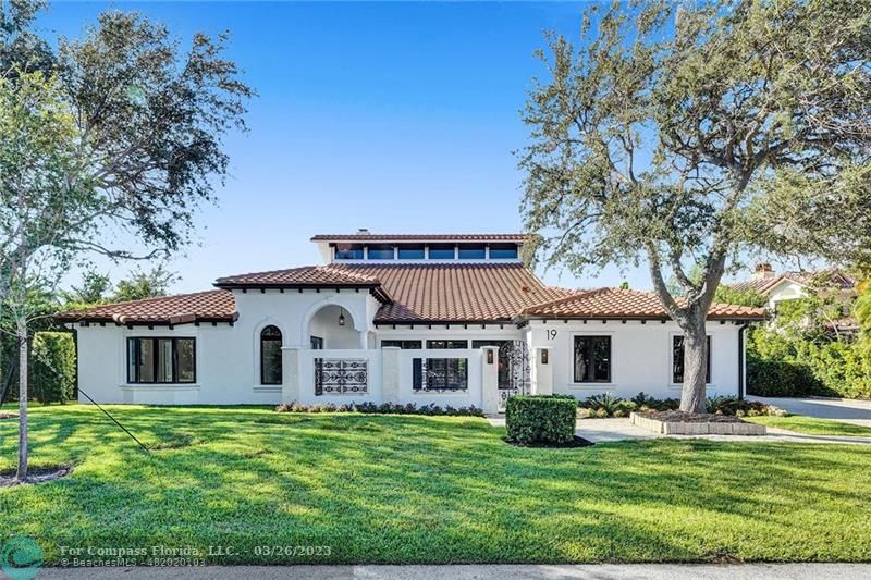 19 Seneca Road Sea Ranch Lakes, FL 33308 - Photo 9 of 48 a view of a house with a yard