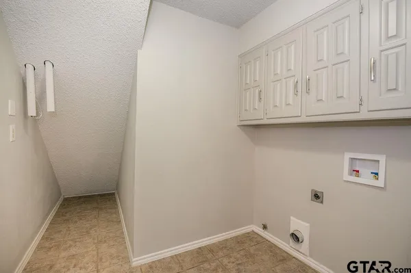 a view of room with washer and dryer