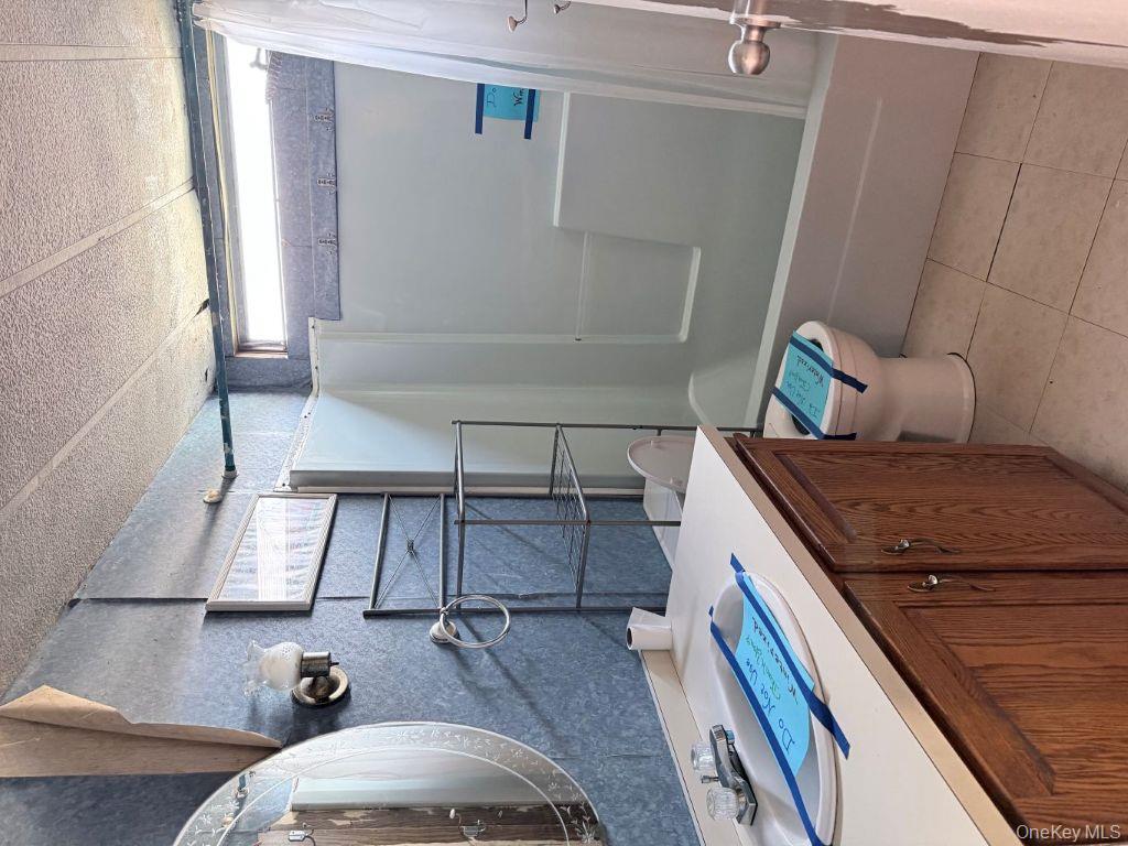 23 Clearview Road Wingdale, NY 12594 - Photo 12 of 21 a bathroom with a sink a toilet and shower