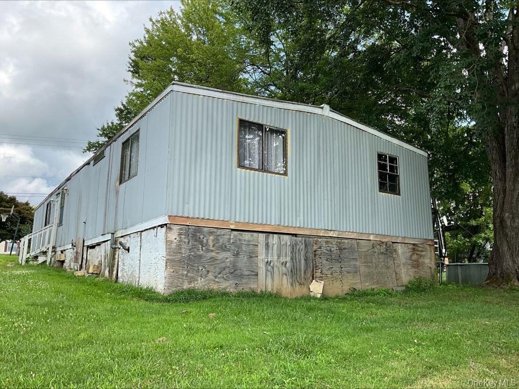 23 Clearview Road Wingdale, NY 12594 - Photo 5 of 21 a backyard of a house with lots of green space and garden