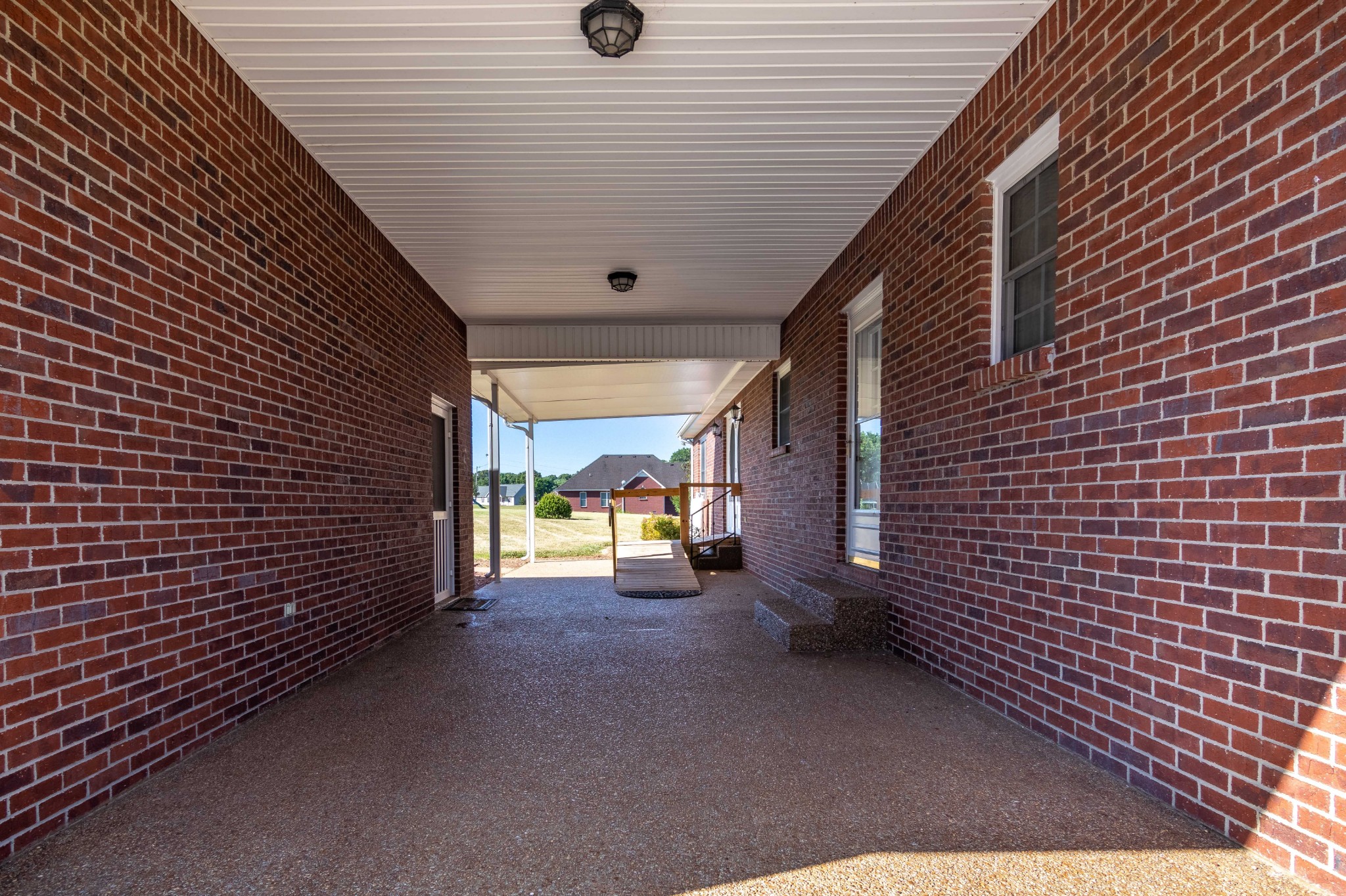 1009 Hummingbird Court Springfield, TN 37172 - Photo 4 of 18 a view of a patio with table and chairs