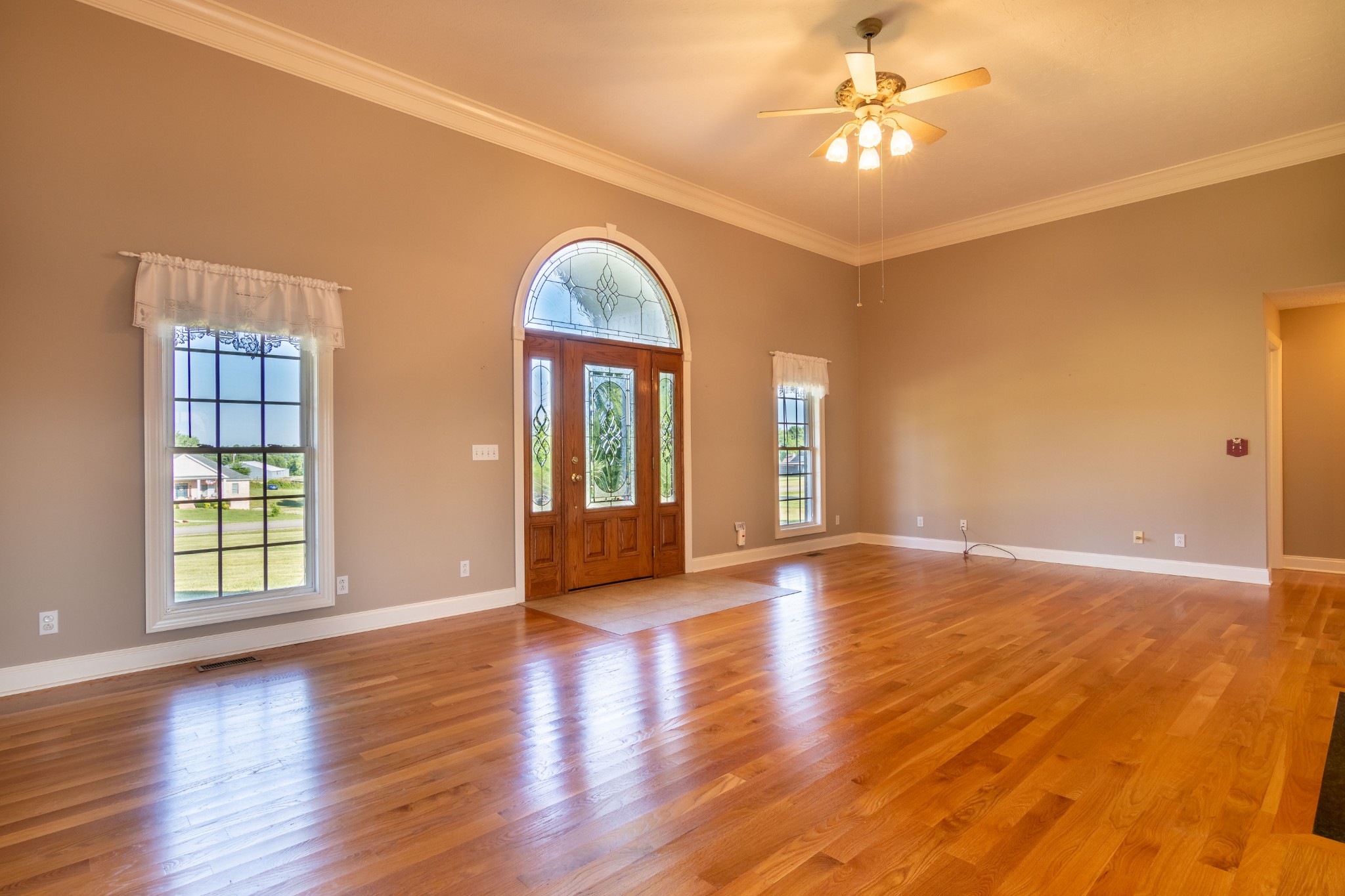 1009 Hummingbird Court Springfield, TN 37172 - Photo 8 of 18 a view of an empty room with window and wooden floor
