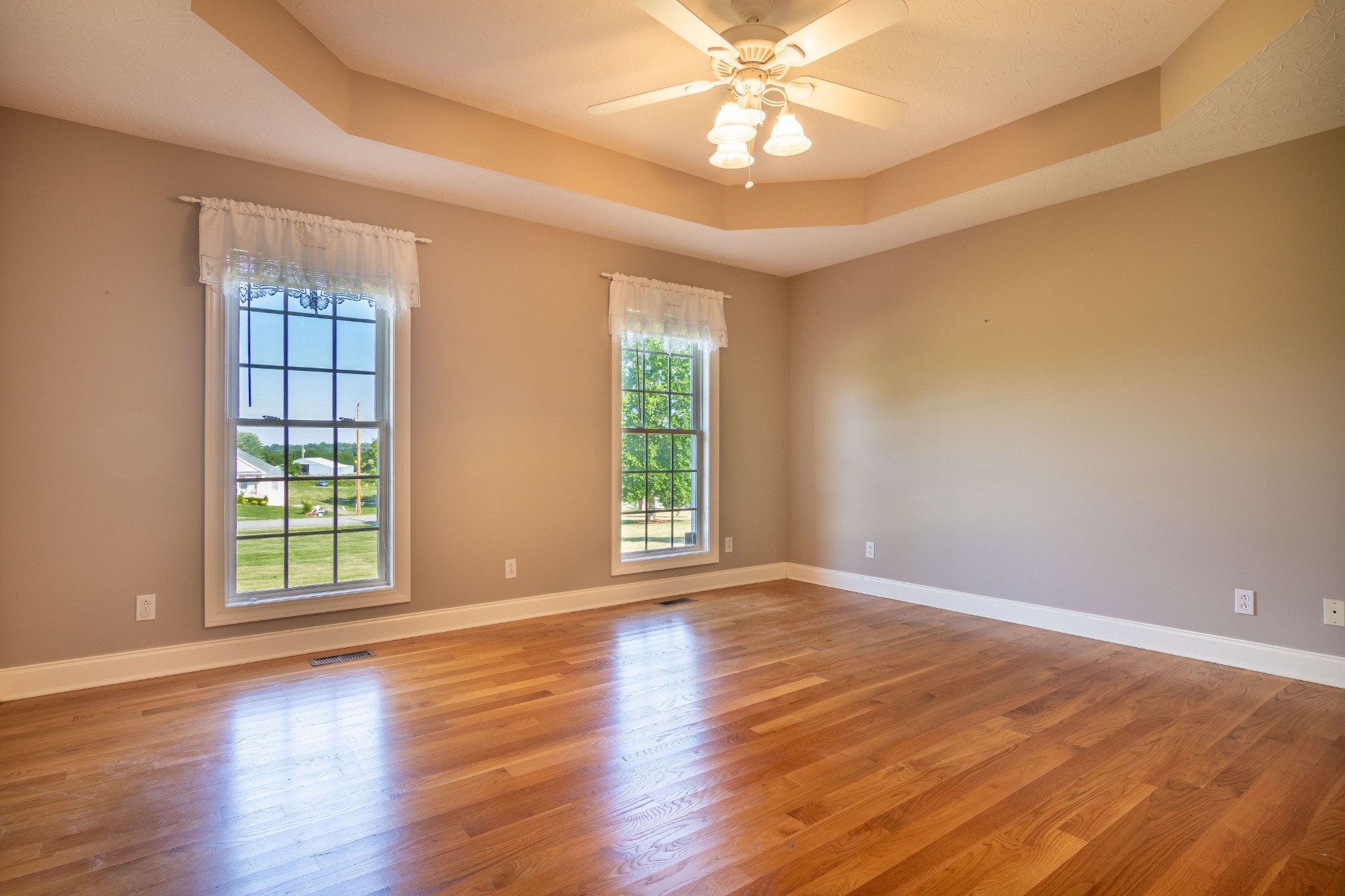 1009 Hummingbird Court Springfield, TN 37172 - Photo 9 of 18 a view of an empty room with wooden floor and a window