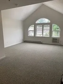 an empty room with a fireplace