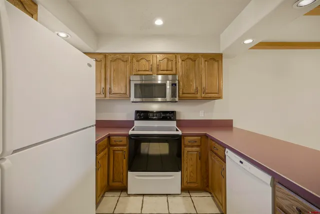 a kitchen with a stove and a microwave