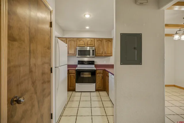 a kitchen with stainless steel appliances a refrigerator and a stove