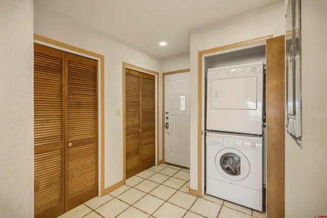 a view of a hallway with washer and dryer