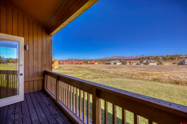 a view of a balcony with an ocean view