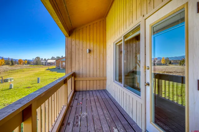 a view of balcony with floor to ceiling window wooden floor and outdoor space