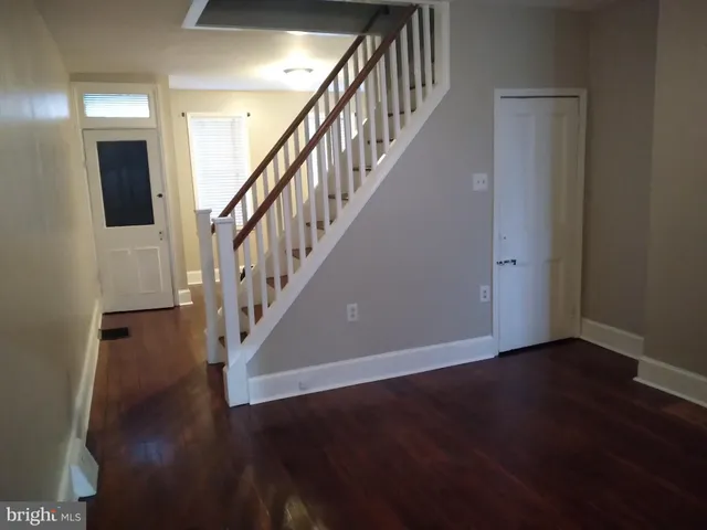 a view of entryway with wooden floor