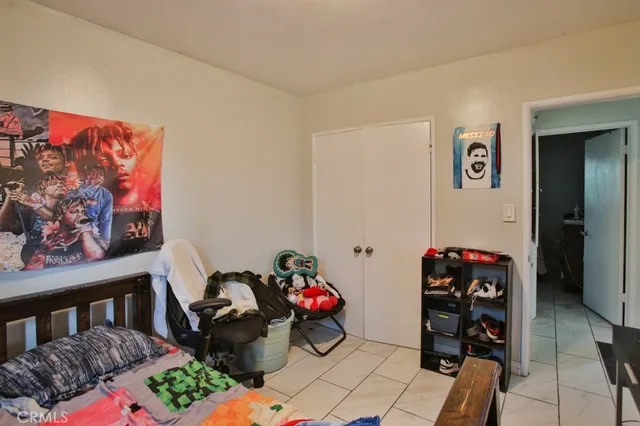 a bedroom with furniture and a book shelf