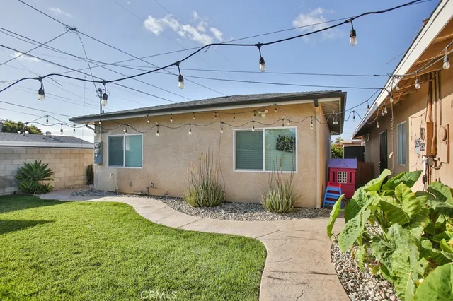 a front view of a house with outdoor seating