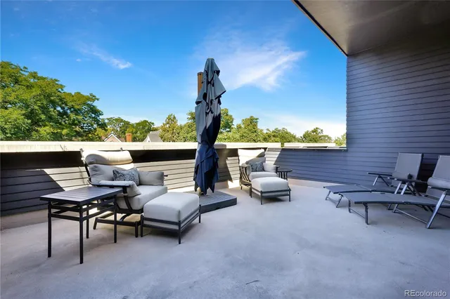 a large kitchen with stainless steel appliances a lot of counter space and a wooden floors