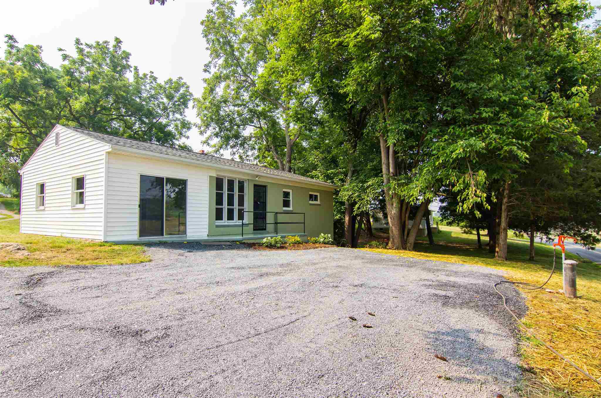 4133 Oak Ridge Road Mount Crawford, VA 22841 - Photo 1 of 30 a front view of a house with a yard and trees