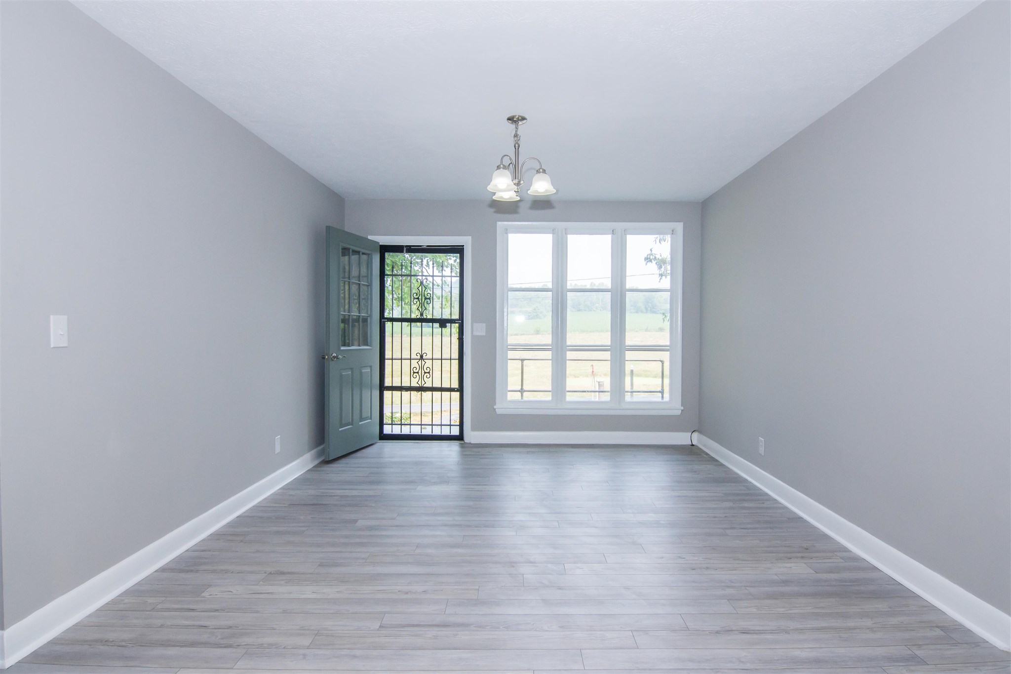 4133 Oak Ridge Road Mount Crawford, VA 22841 - Photo 13 of 30 wooden floor in an empty room with a window