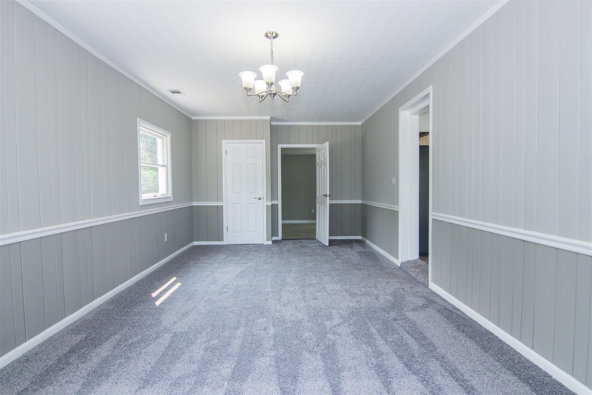 4133 Oak Ridge Road Mount Crawford, VA 22841 - Photo 16 of 30 a view of an empty room with window and wooden floor
