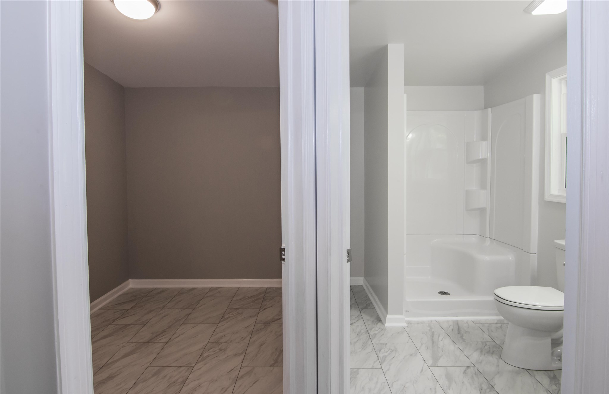 4133 Oak Ridge Road Mount Crawford, VA 22841 - Photo 21 of 30 a bathroom with a granite countertop toilet and a shower