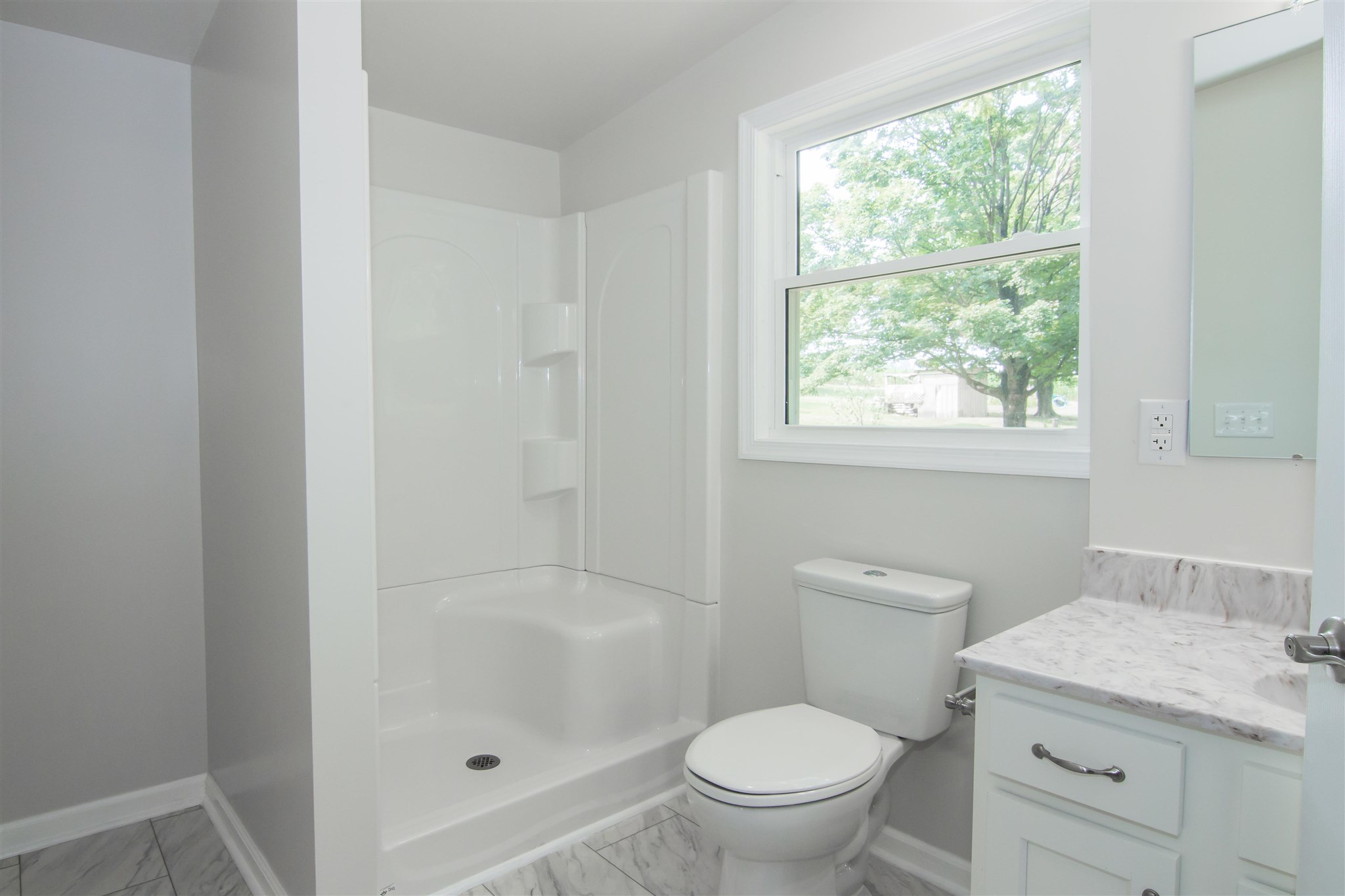 4133 Oak Ridge Road Mount Crawford, VA 22841 - Photo 22 of 30 a bathroom with a granite countertop toilet a sink and a shower