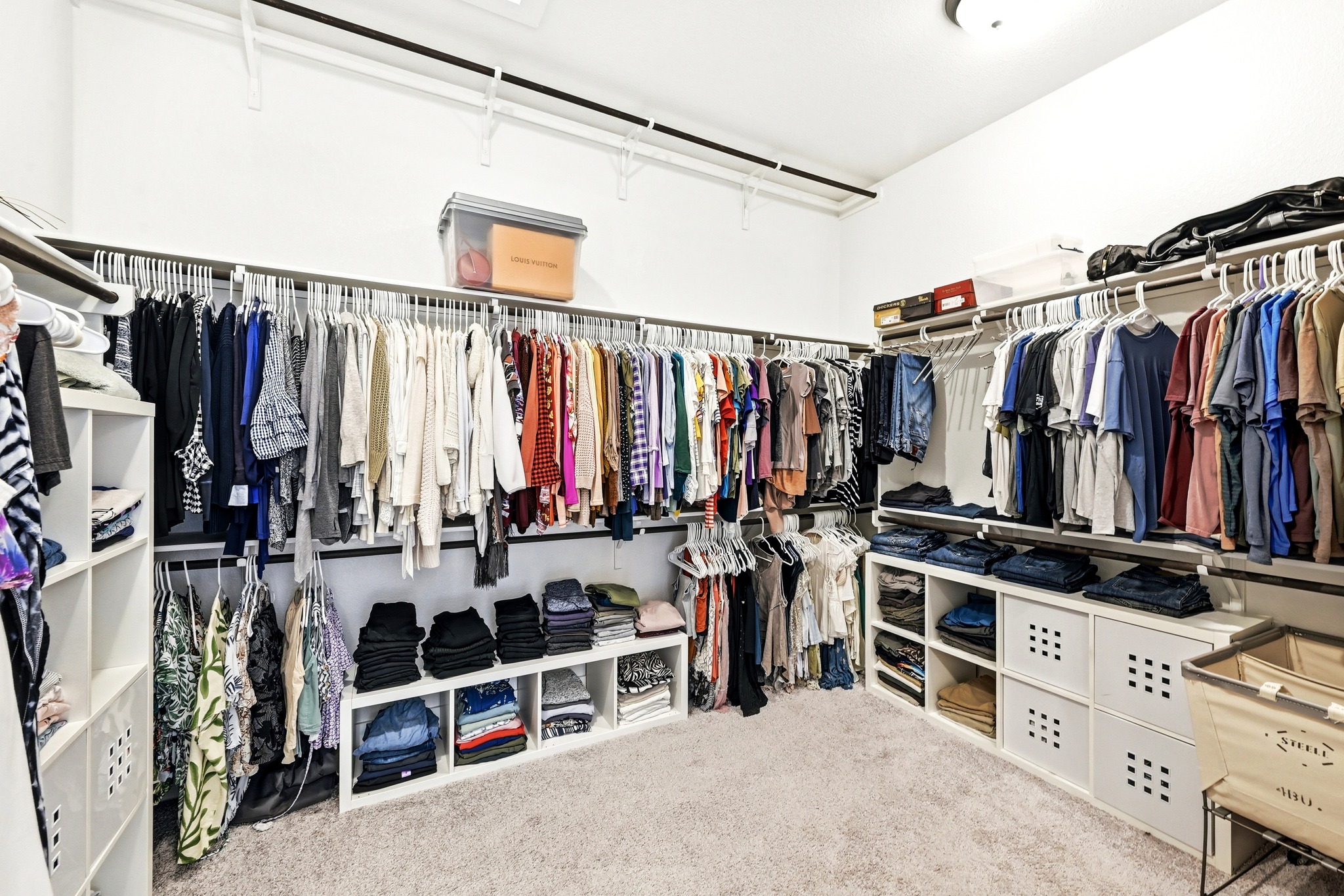 9008 Harper Rae Drive Austin, TX 78717 - Photo 23 of 39 Spacious walk-in closet featuring extensive built-in shelving, multiple hanging rods, durable carpet flooring, and recessed ceiling lighting