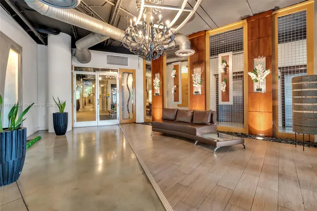 a building outdoor space with patio furniture and potted plants