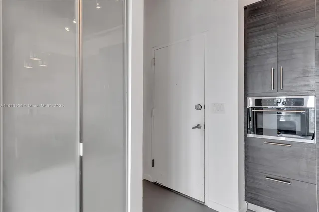 a view of a kitchen from the hallway