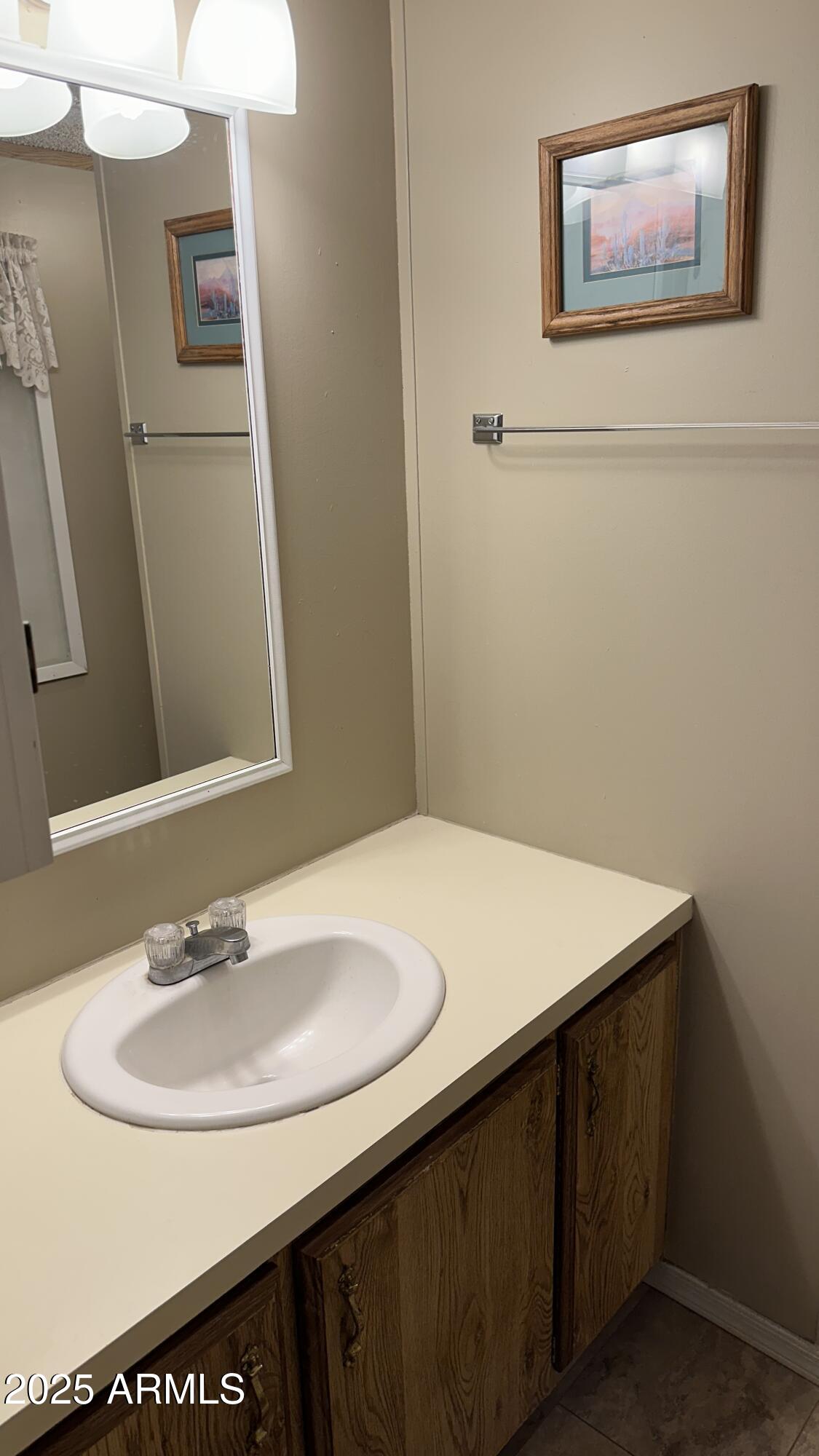834 South Meridian Road, Unit 105 Apache Junction, AZ 85120 - Photo 20 of 48 a bathroom with a sink and a mirror
