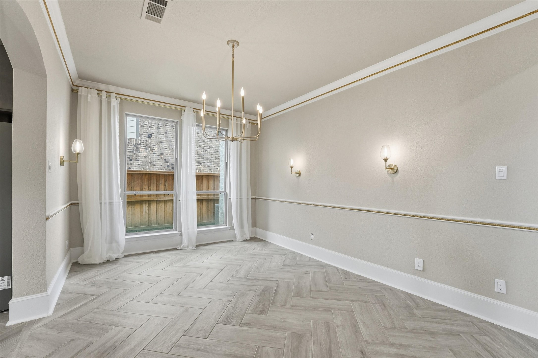 8673 Burdekin Road Magnolia, TX 77354 - Photo 11 of 50 a view of an empty room with a glass door