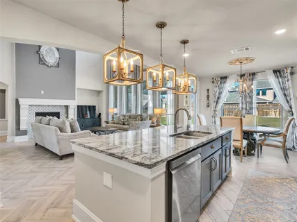 a view of living room and kitchen