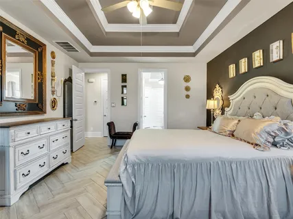 a bedroom with a bed and a dresser