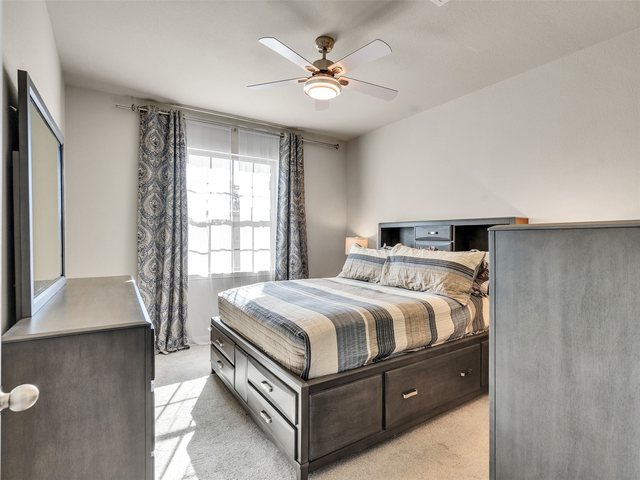 8673 Burdekin Road Magnolia, TX 77354 - Photo 29 of 48 a bedroom with a bed and window