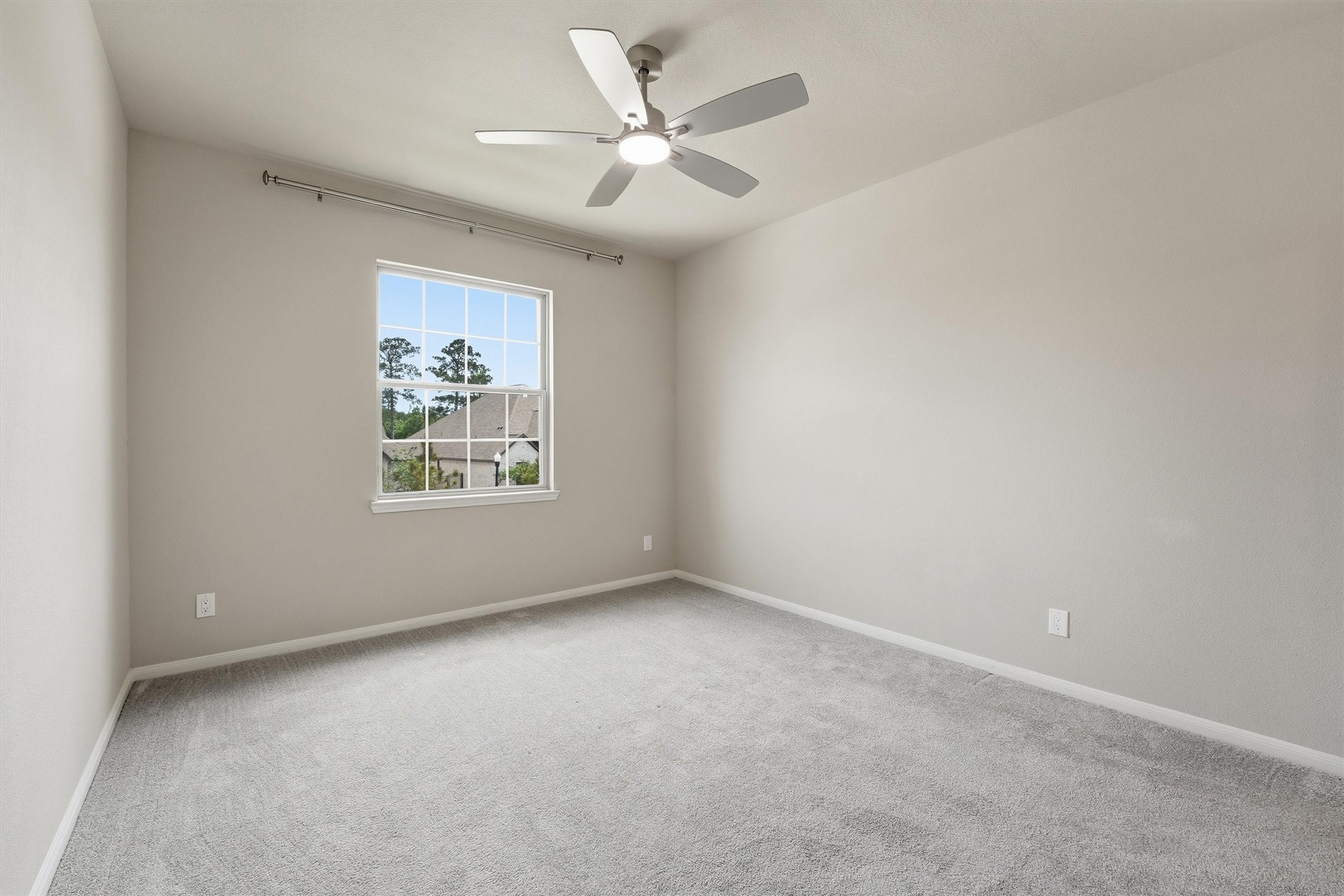 8673 Burdekin Road Magnolia, TX 77354 - Photo 34 of 50 an empty room with windows and fan