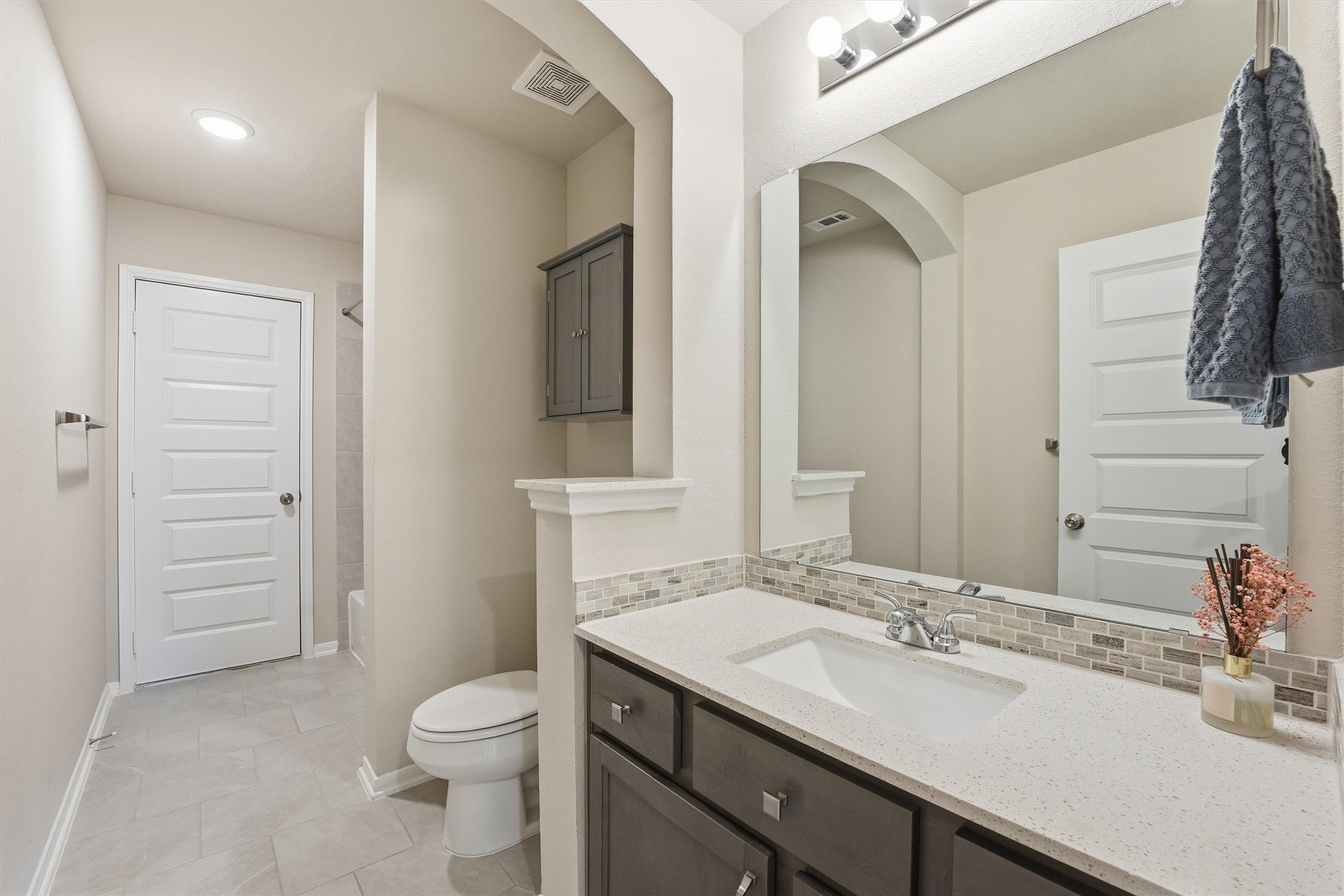8673 Burdekin Road Magnolia, TX 77354 - Photo 35 of 50 Ensuite Bath for BR #2. Walk in attic is behind the door in foreground.