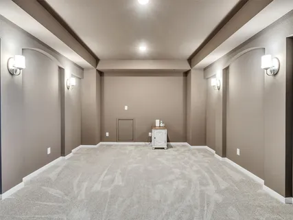 a large bathroom with a large mirror vanity and shower