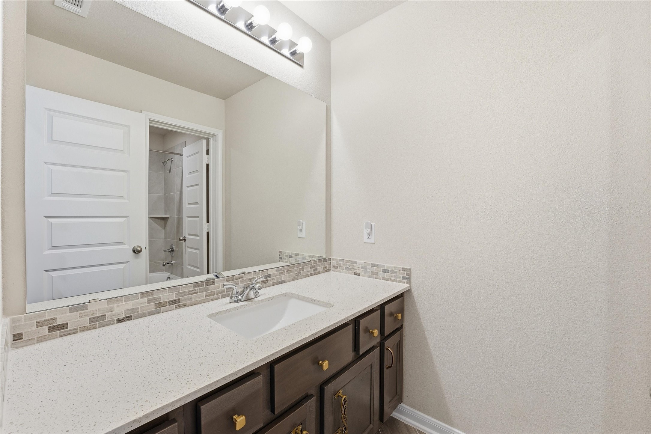 8673 Burdekin Road Magnolia, TX 77354 - Photo 39 of 50 a bathroom with a sink and a mirror