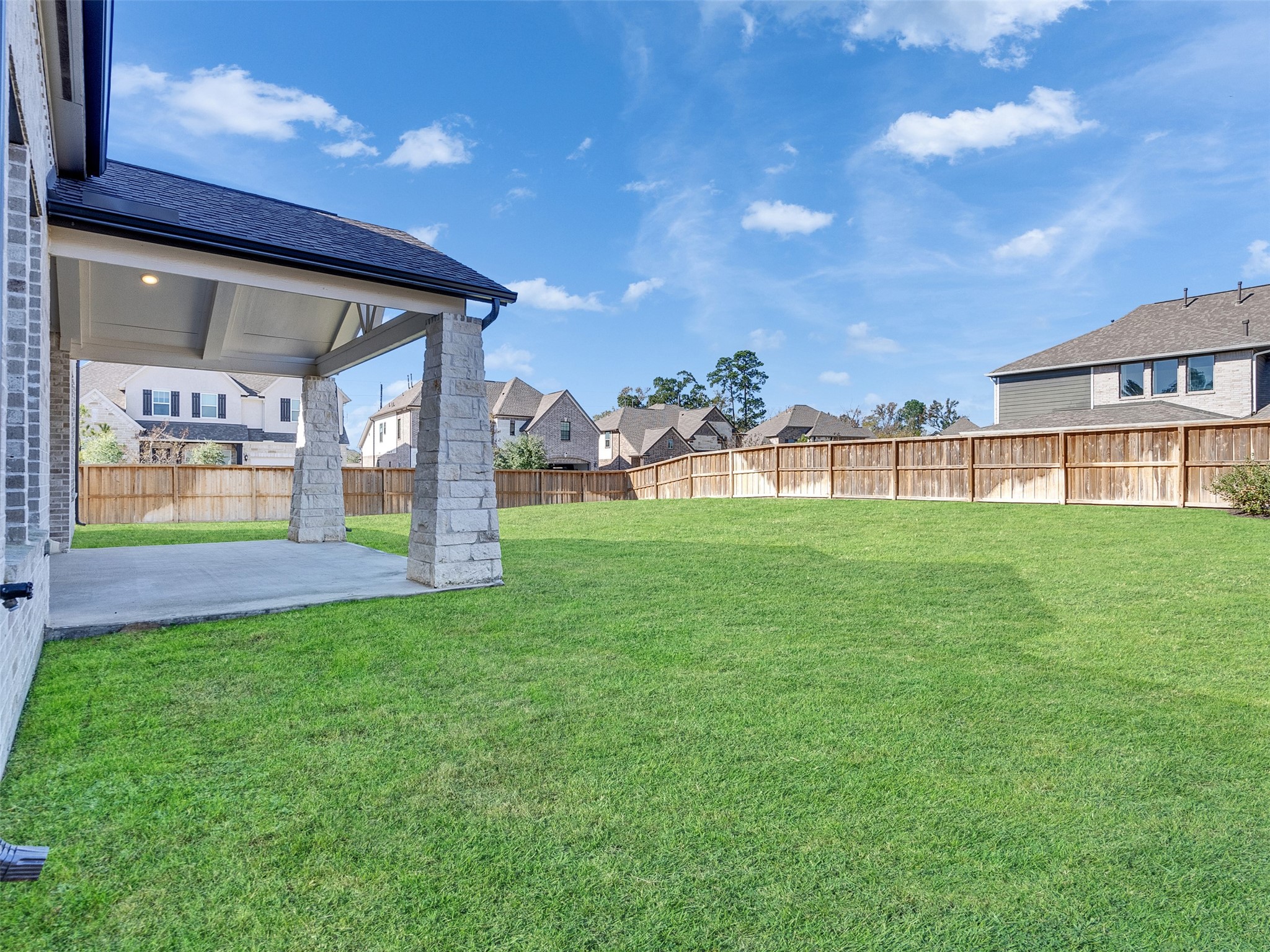 8673 Burdekin Road Magnolia, TX 77354 - Photo 40 of 48 a view of a house with a yard