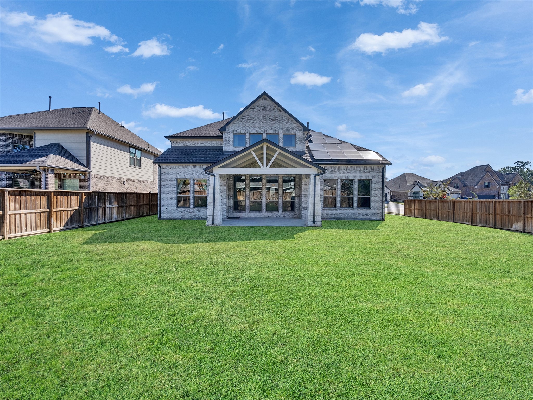 8673 Burdekin Road Magnolia, TX 77354 - Photo 41 of 48 a view of a big house with a big yard and large trees