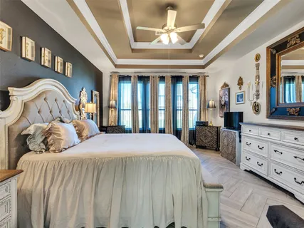 a bedroom with a bed and a dresser